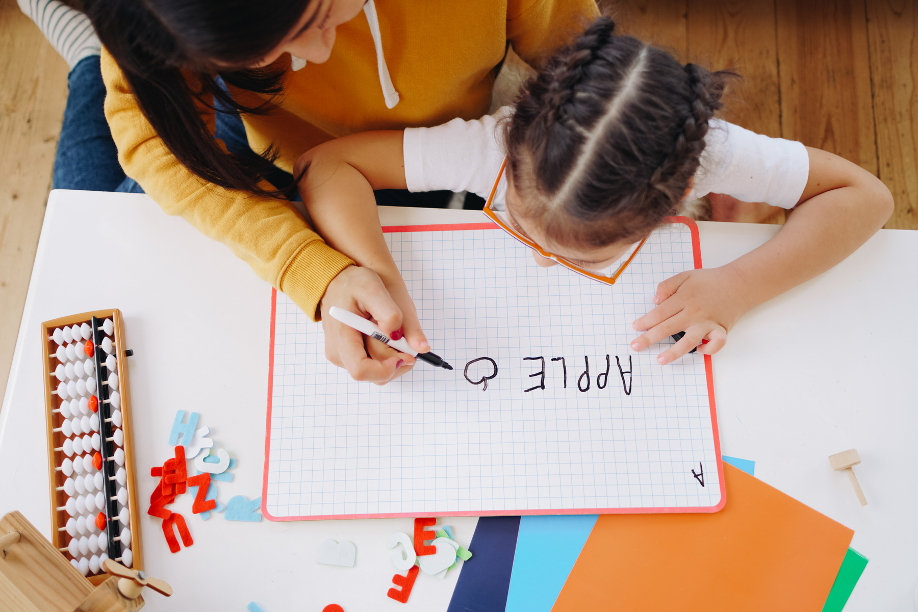 Woman Teaching Child